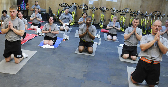Spc. David Kocian, a human resources specialist in the Pennsylvania National Guard's 28th Combat Aviation Brigade, teaches a yoga class at Camp Adder, Iraq. The 21-year Army veteran is a Pittsburgh, Pa., native, and Palmyra resident. He bagan teaching yoga during the 28th CAB's mobilization because soldiers showed significant interest when they discovered he was an avid student of yoga.